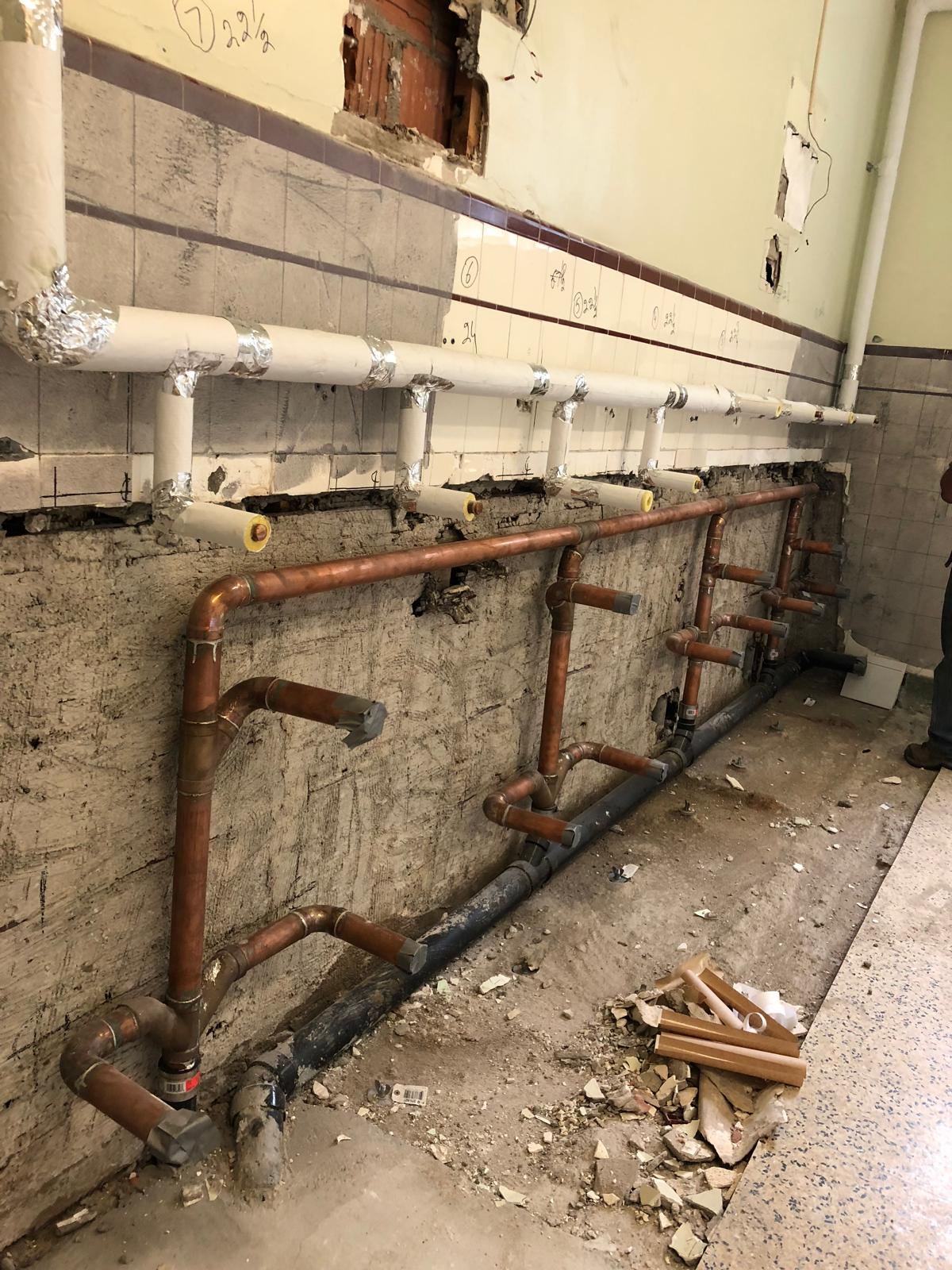 Corridor copper piping installation
