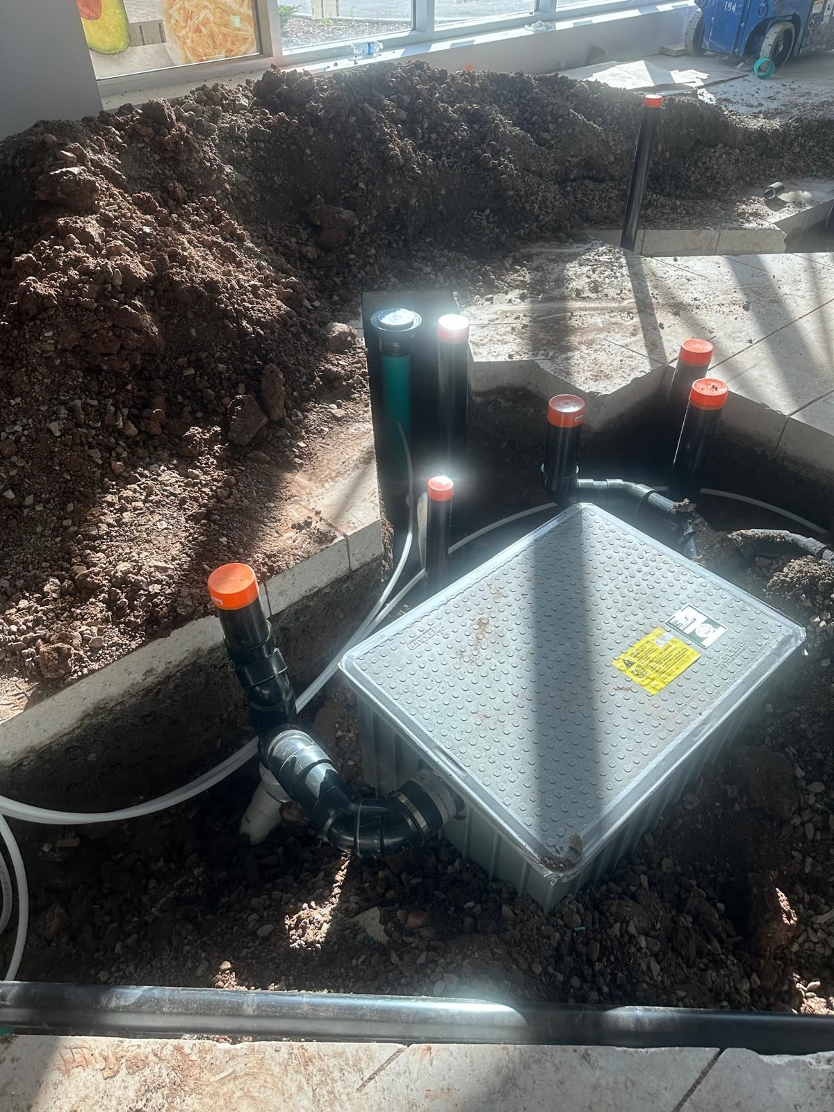 Grease interceptor installation under slab